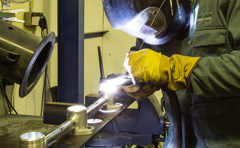 A Racing Green craftsman at work in the workshop